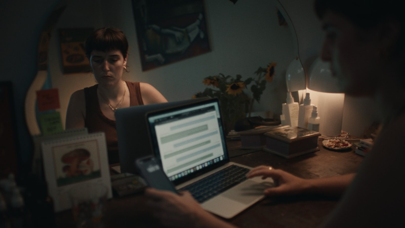 Lead actor Ruby Blinkhorn on the phone in a single-room set