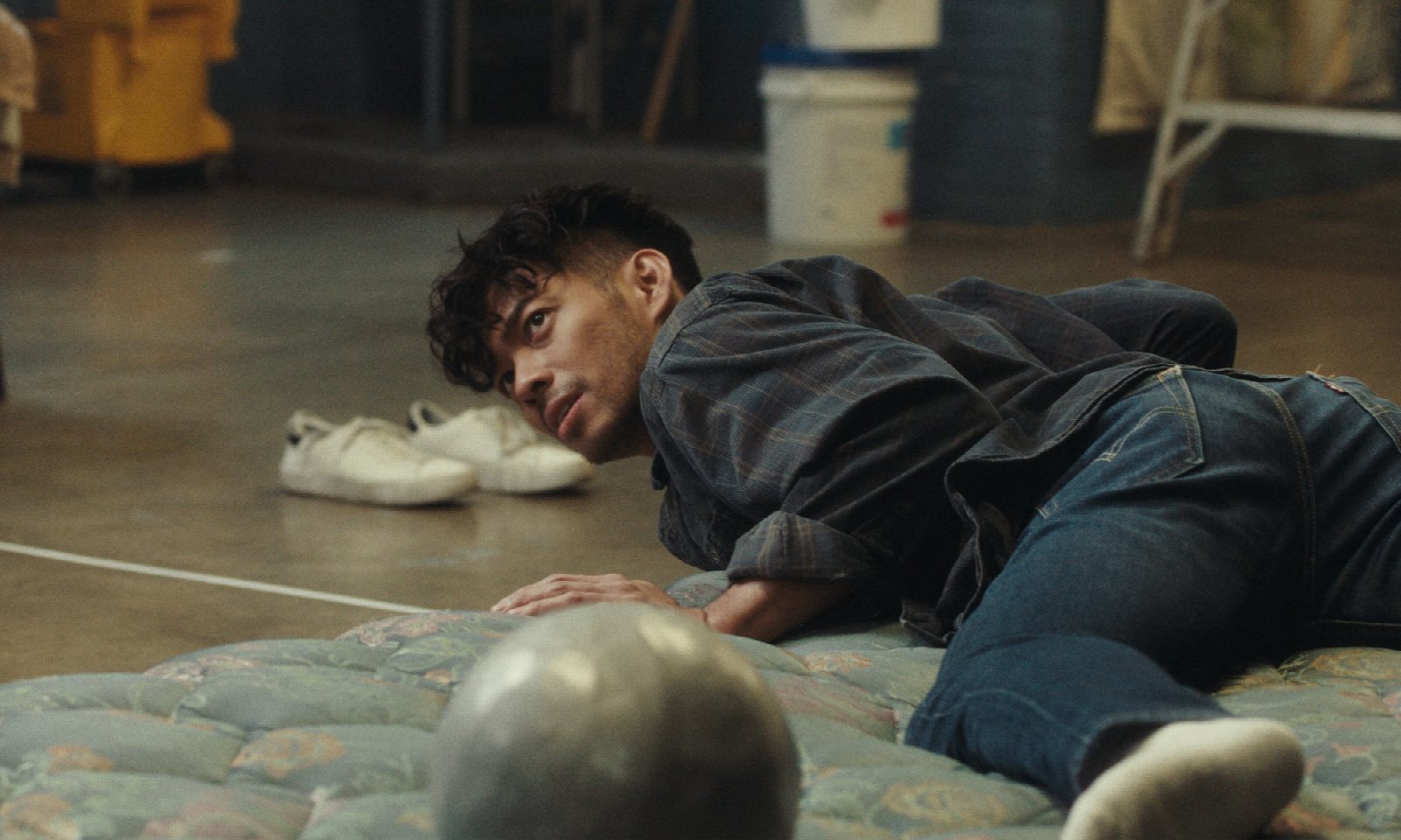 Two actors rehearsing a tense scene on a film set, mid-shot
